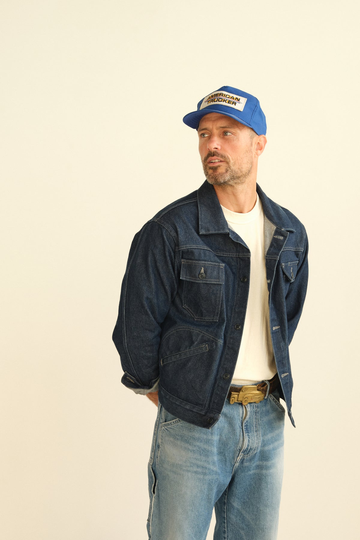 Vintage dark denim trucker jacket with button-front and chest flap pockets