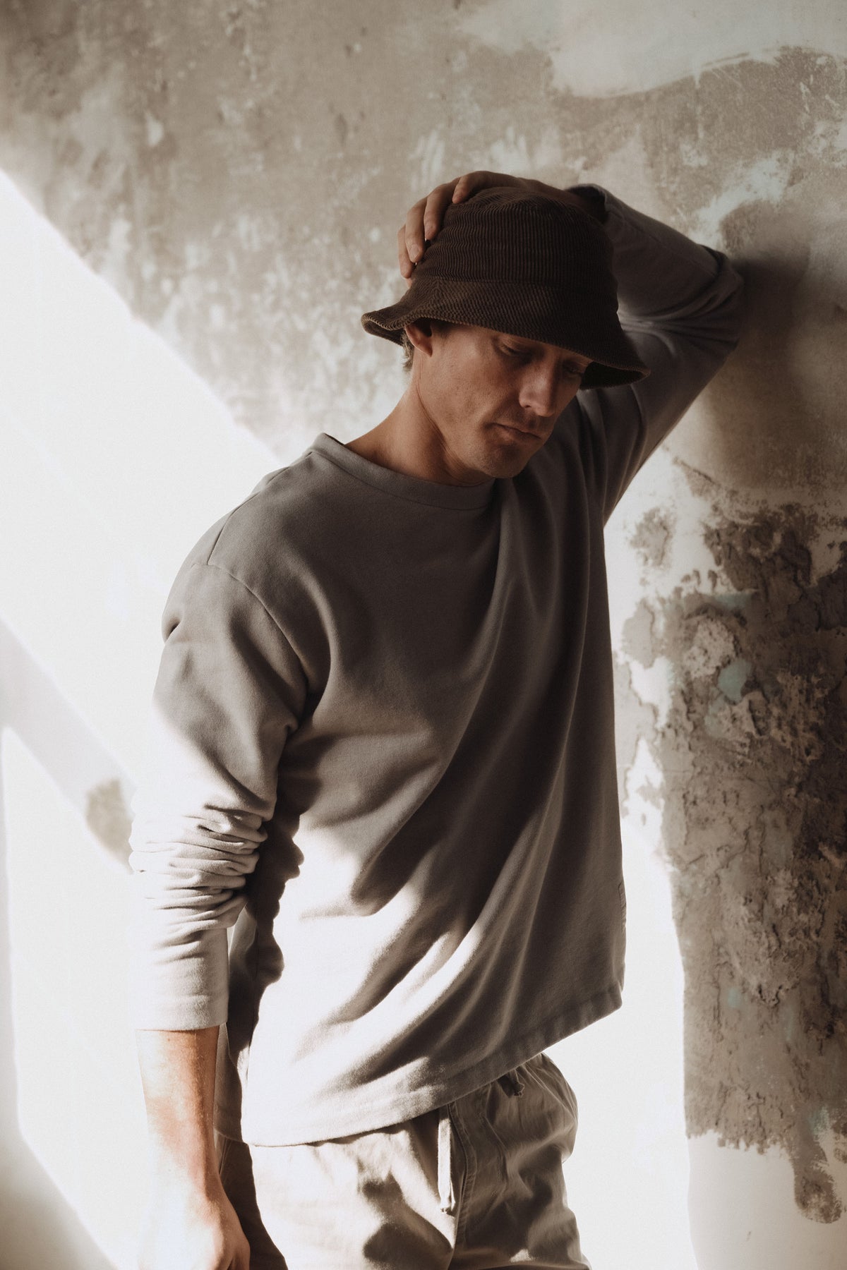 Dark brown crewneck terry sweatshirt on model with long sleeves