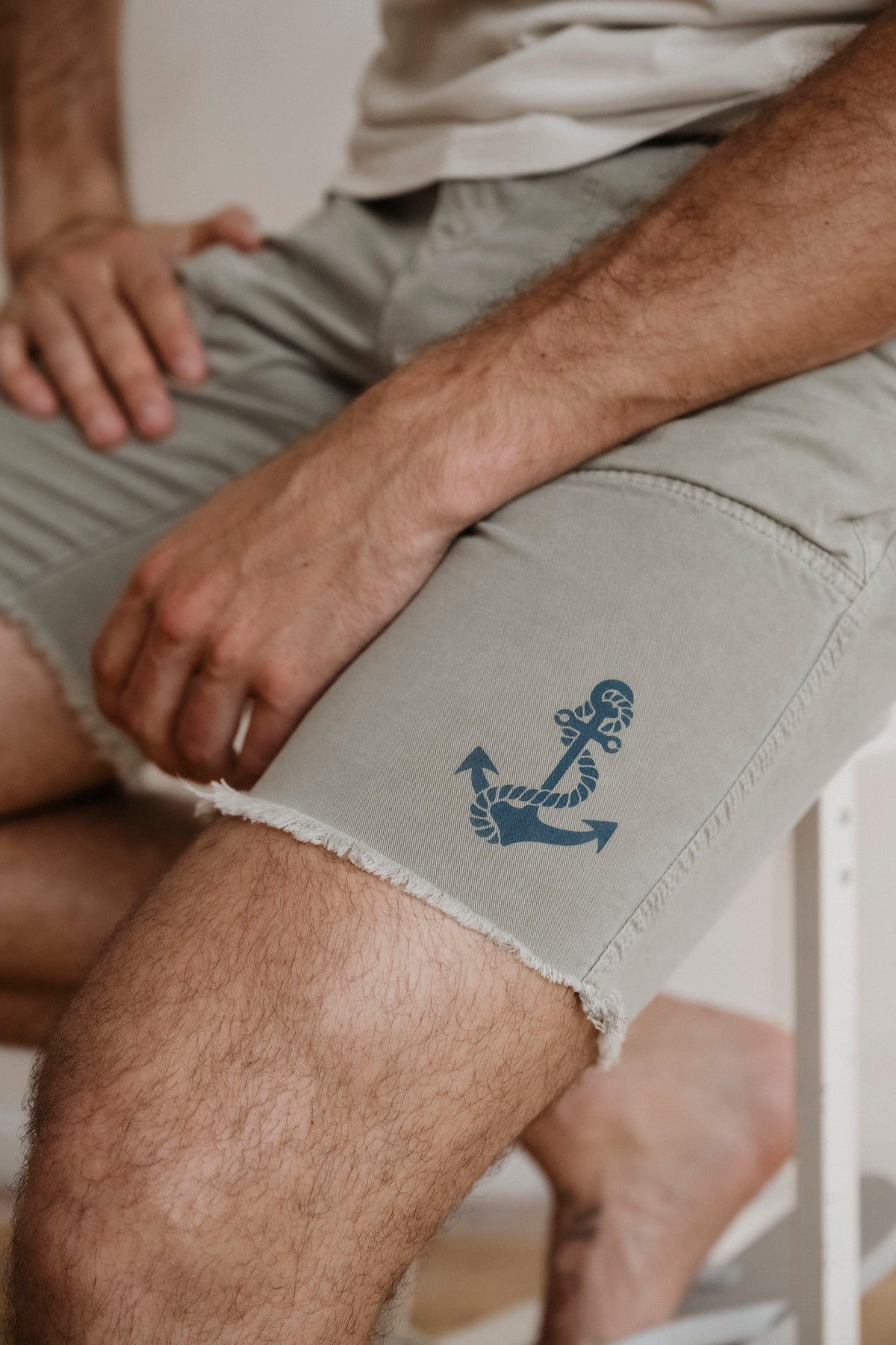 Lichen anchor logo surplus shorts close-up with frayed hem