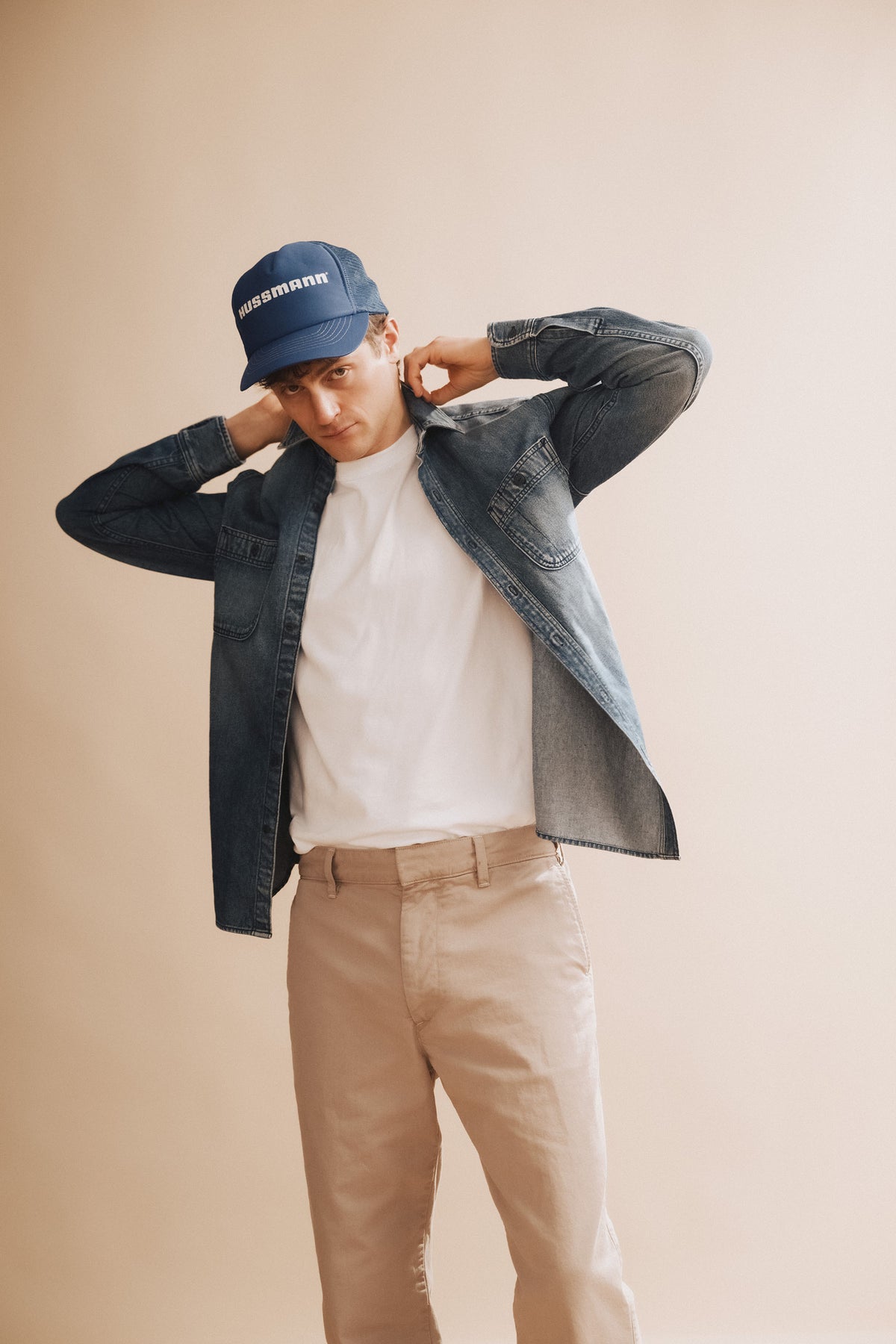 Stone-wash denim shirt worn open at the collar with button-front