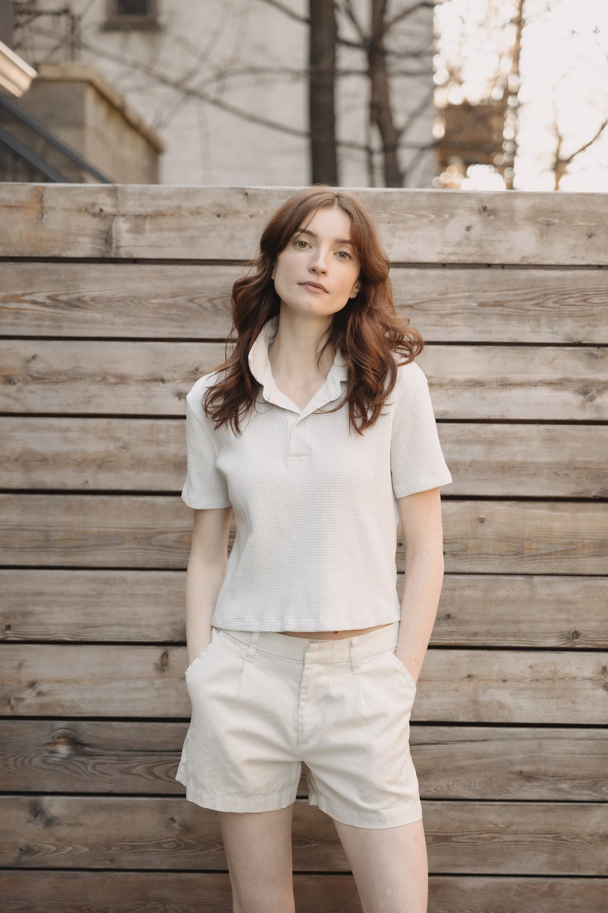 Cream waffle knit boy polo with short sleeves and button-front collar