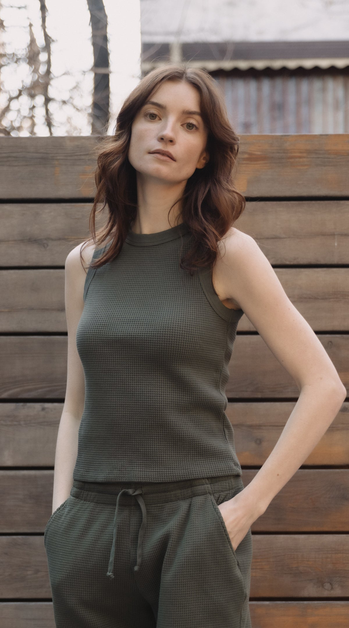 Olive waffle knit tank top on model with crew neckline