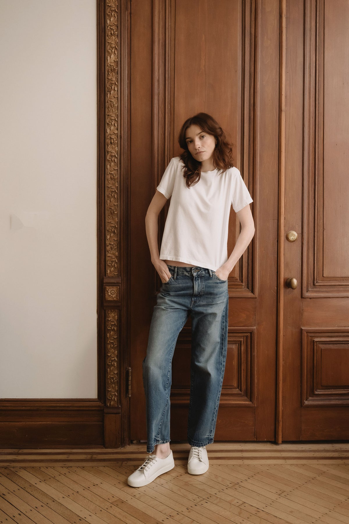 Blue boyfriend-fit denim jeans with straight wide legs and classic front pockets