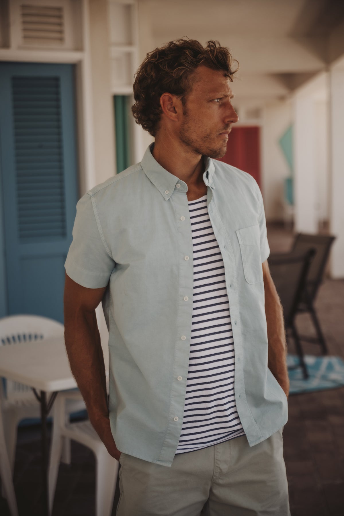 Light blue short-sleeve button-up oxford shirt with chest pocket and pointed collar