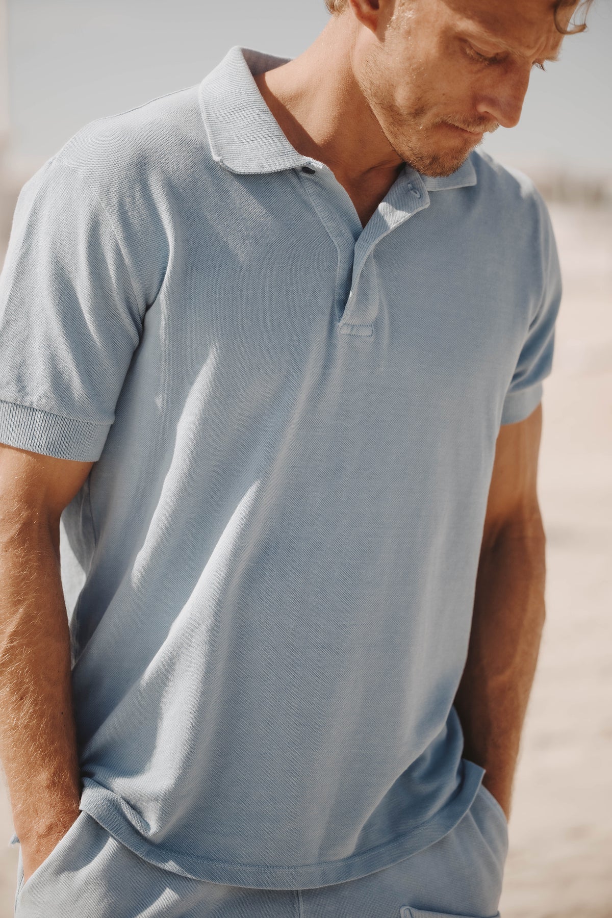 Light blue cotton-hemp pique polo with collar and short sleeves, side view