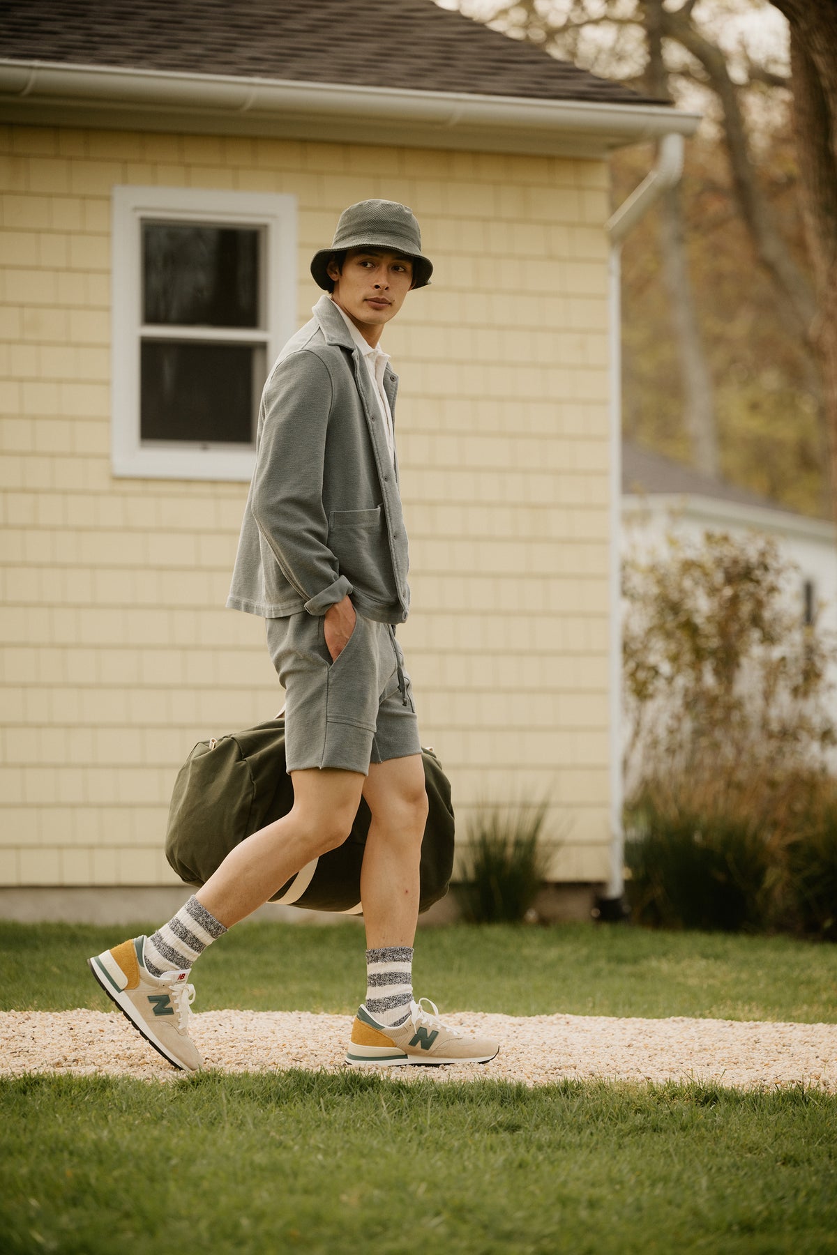Light gray terry utility sweat shorts with drawstring waist and side pockets