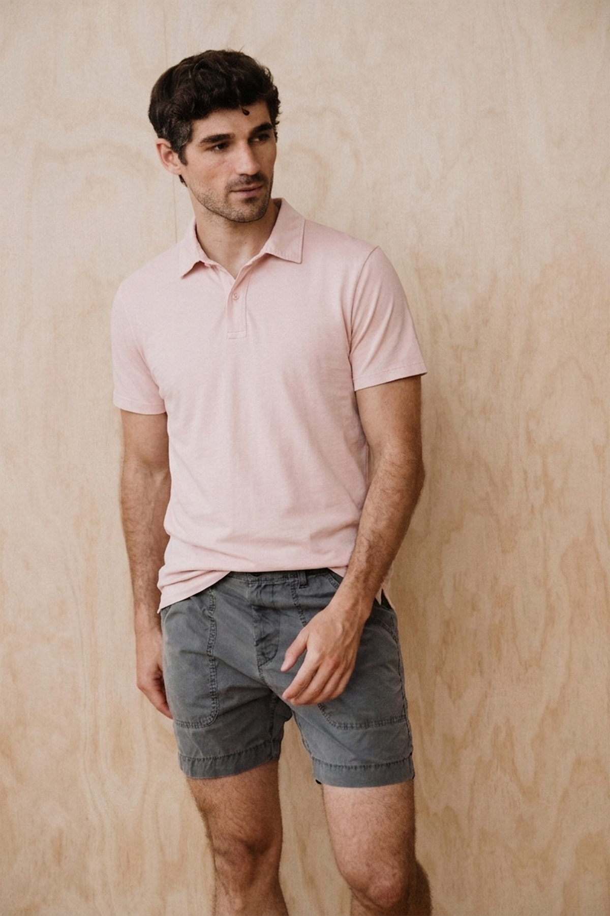 Light pink short-sleeve Supima polo shirt with collar and button placket
