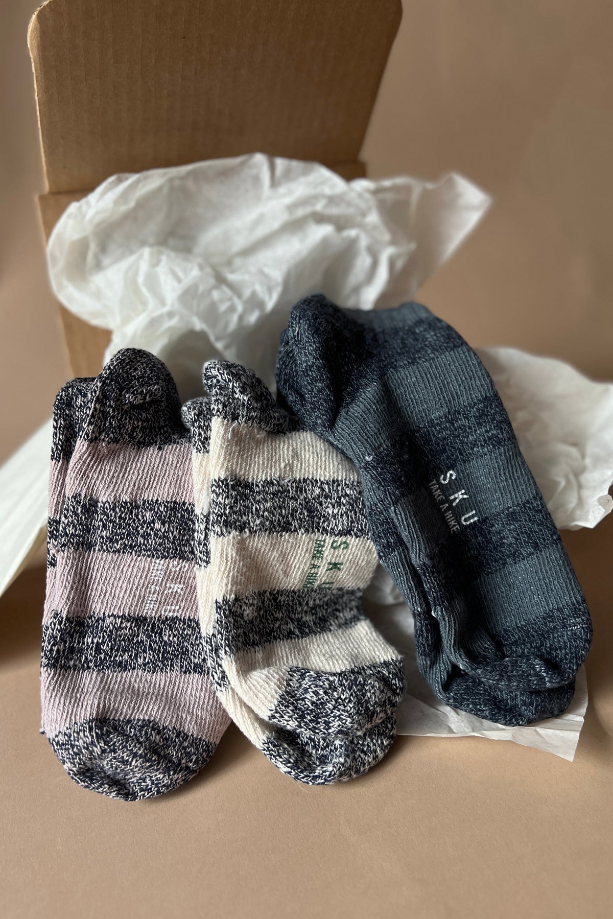 Stripe ragg socks in navy, cream, and light tan with ribbed cuffs