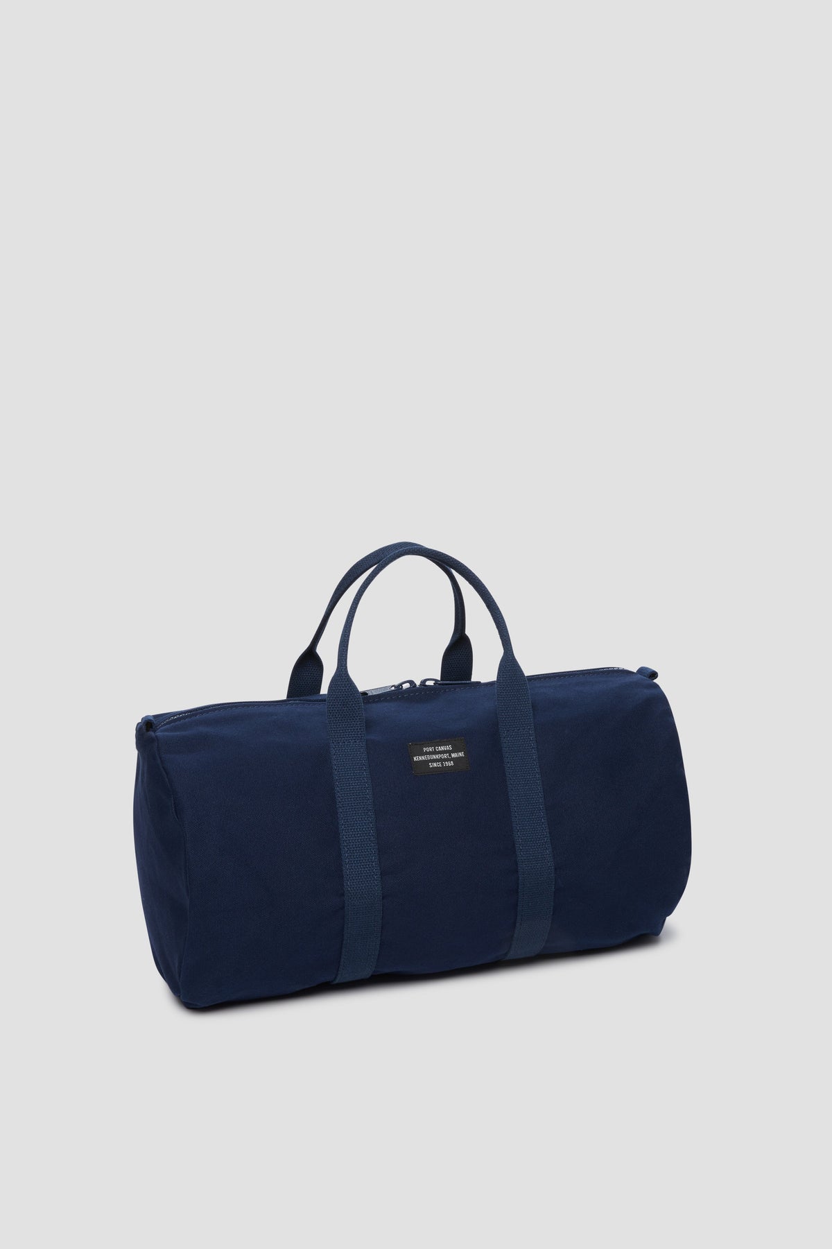 Navy gym duffel bag with top handles and side zipper pocket
