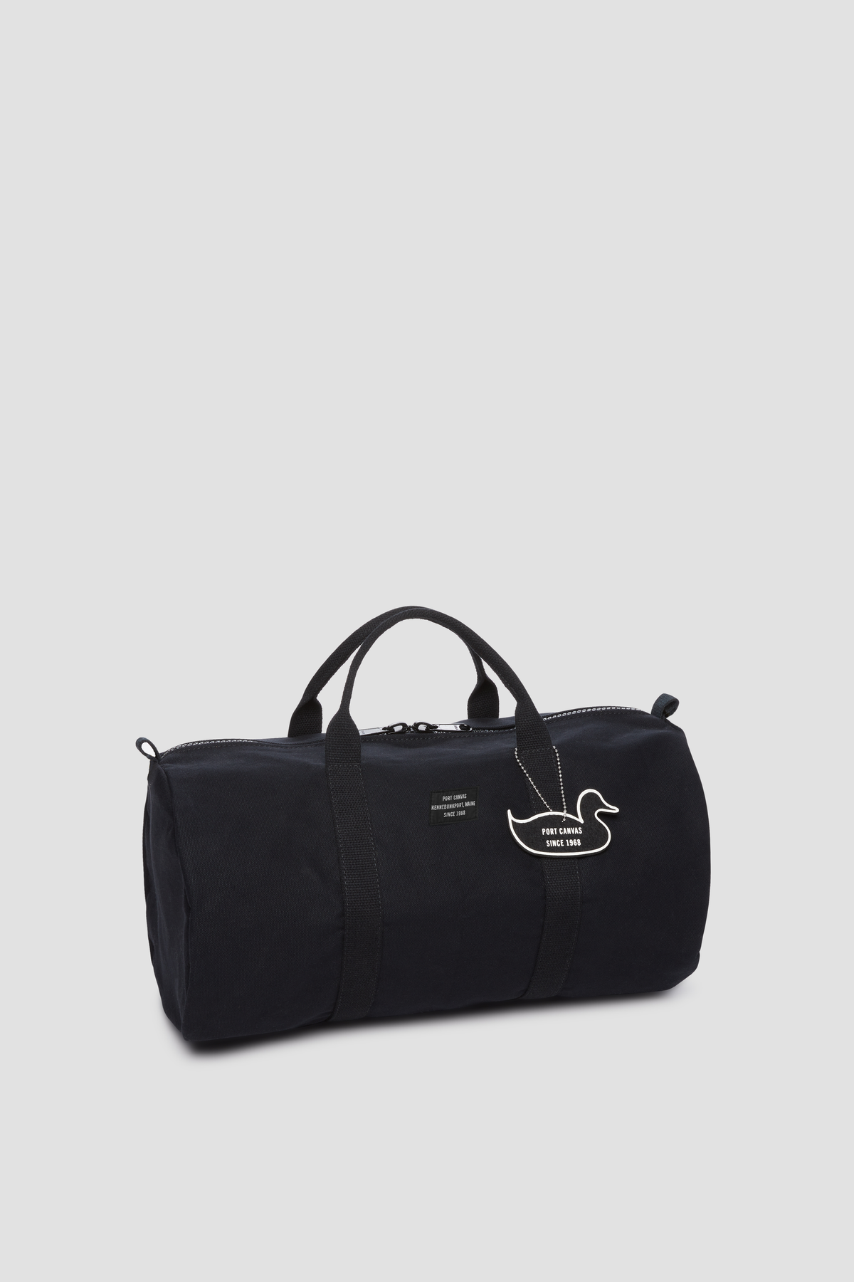 Black gym duffel bag with top handles, zip pocket, and swan logo patch