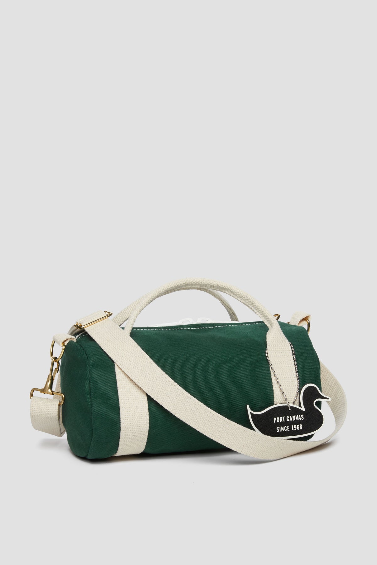 Green duffel kit bag with white stripe, top handle, zip closure, side logo patch