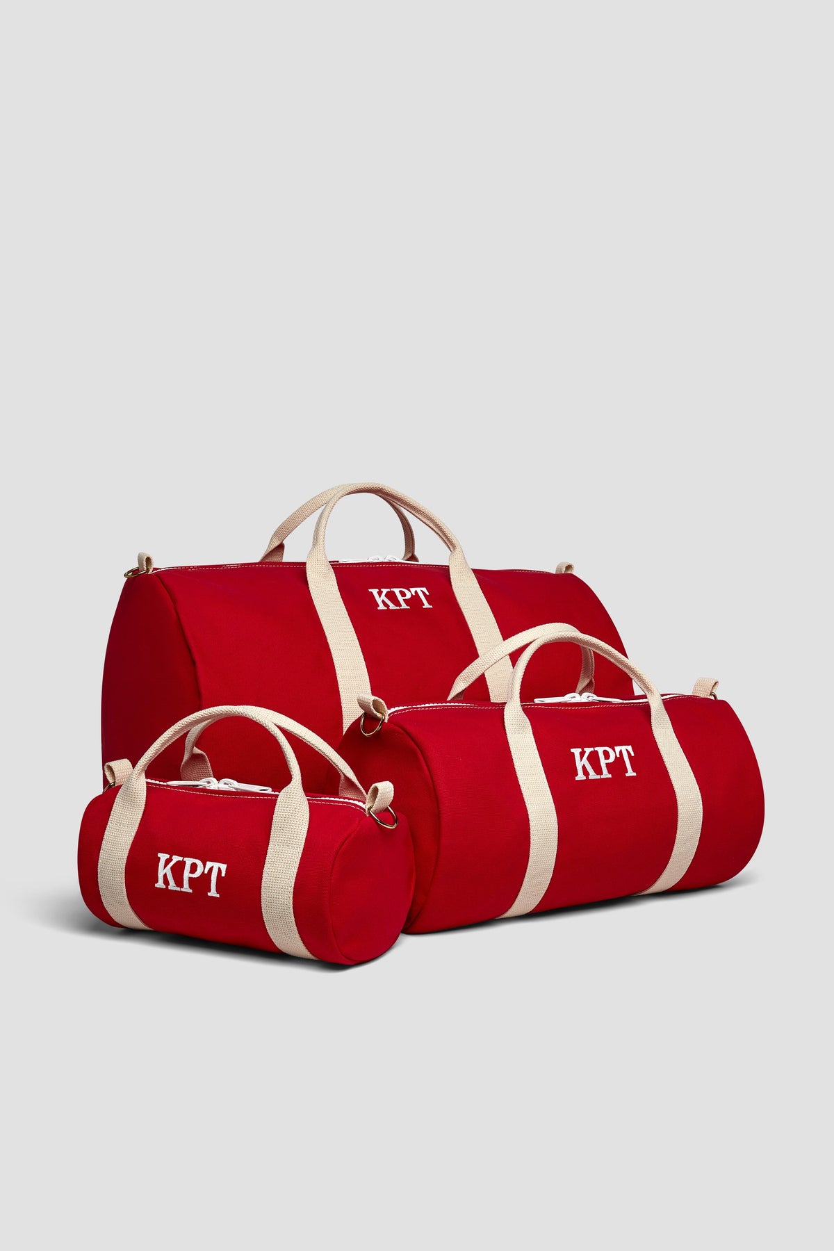 Red duffel bag set of three with cream stripes and KPT logo