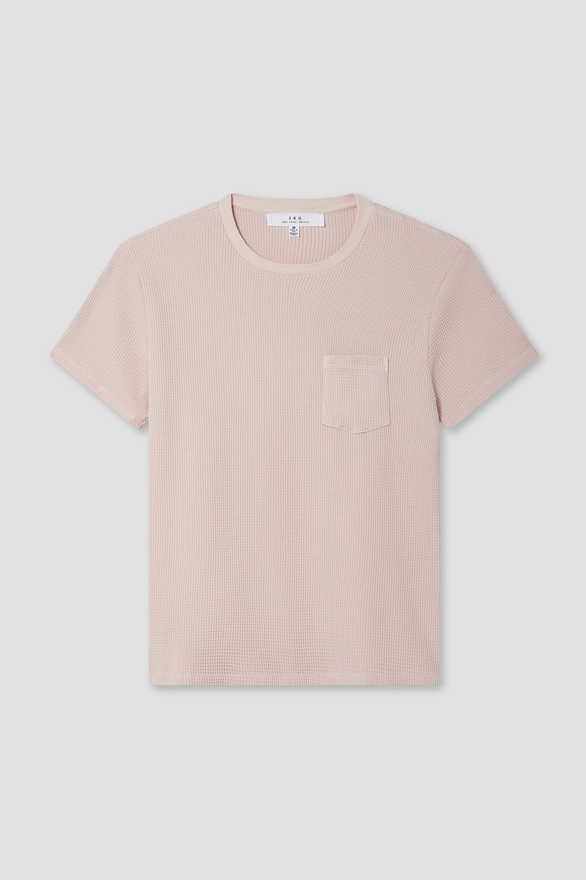 Blush pink waffle pocket tee with short sleeves and crew neck