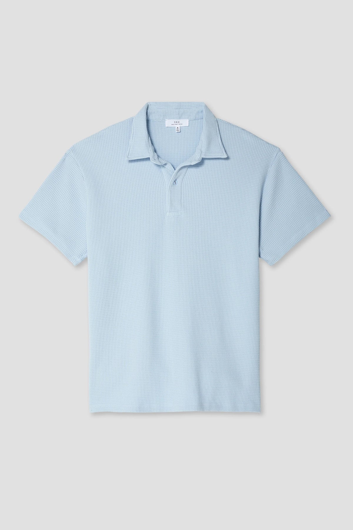 Light blue waffle polo shirt with short sleeves, collar, and button placket.