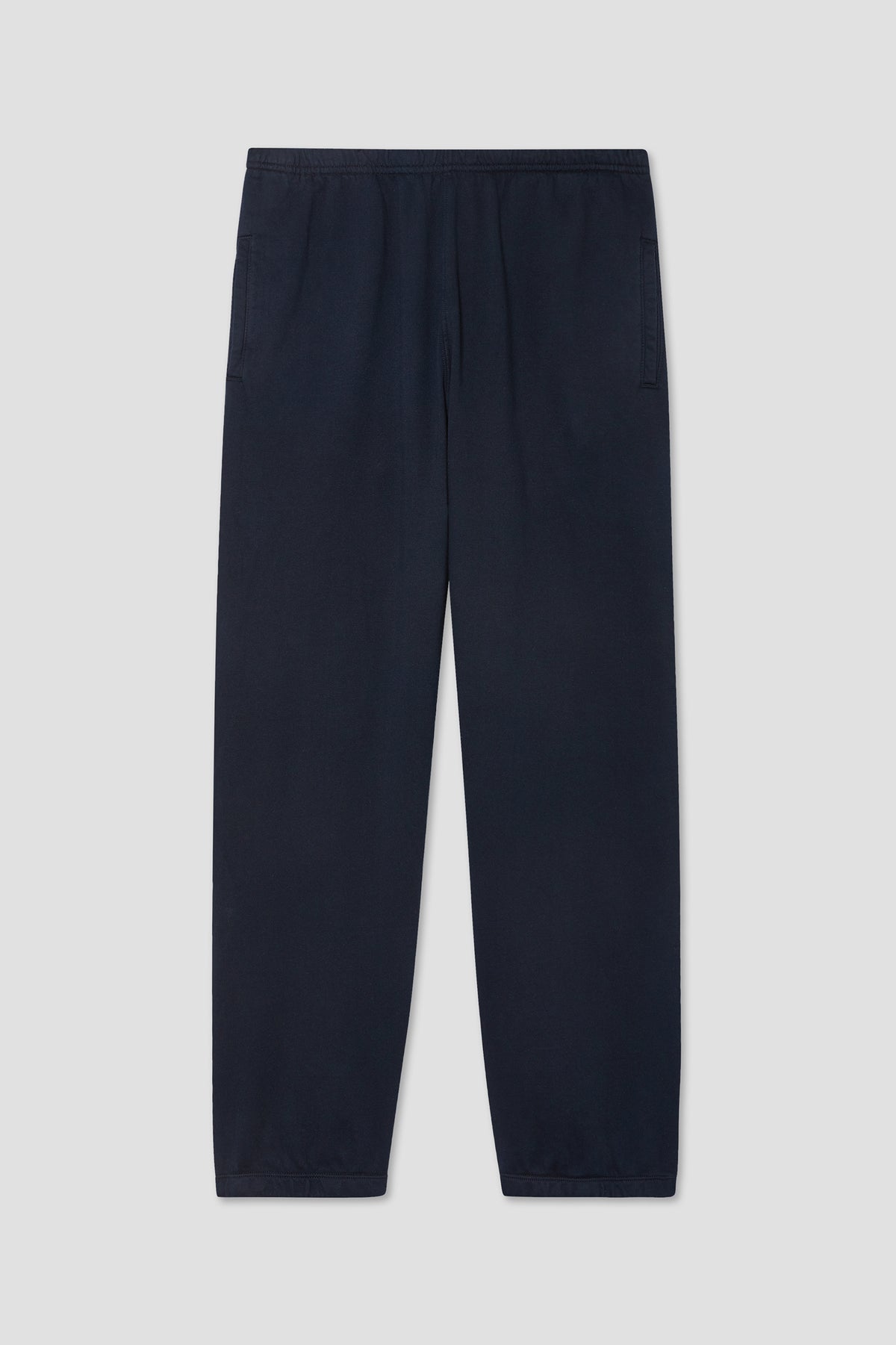 Navy fleece sweatpants with elastic waistband and cuffed leg openings
