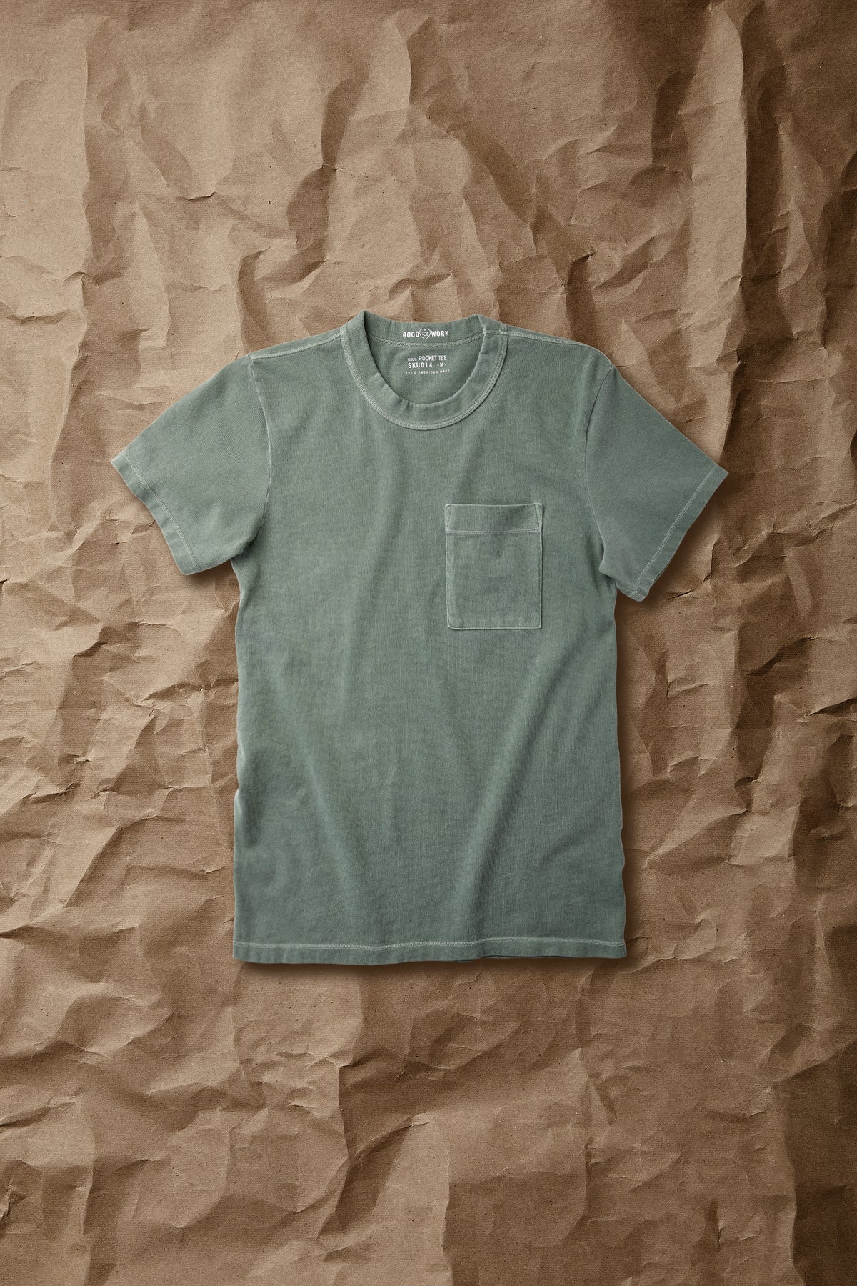 Green short-sleeve jersey pocket tee with crew neck and front chest pocket