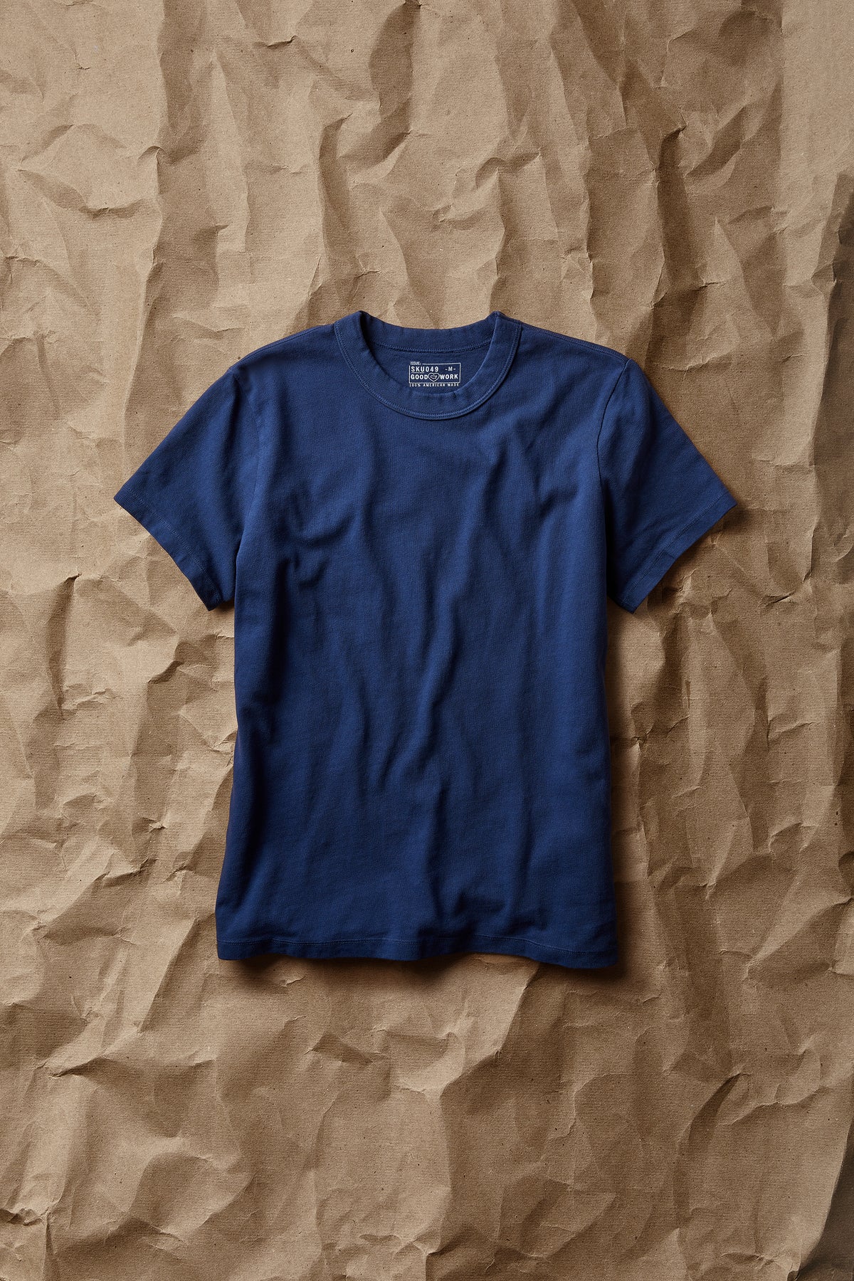 Blue short-sleeve crew-neck T-shirt with ribbed crew collar and straight hem.