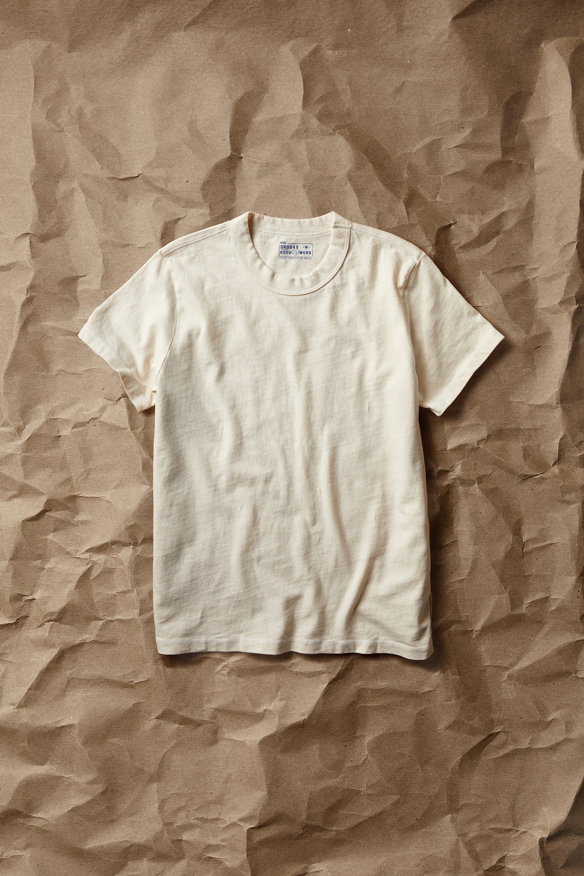 White short-sleeve crew-neck T-shirt with ribbed crew collar and straight hem.
