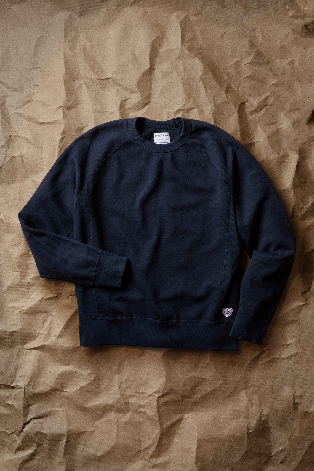 Navy crew neck terry sweatshirt, long sleeves, small chest logo