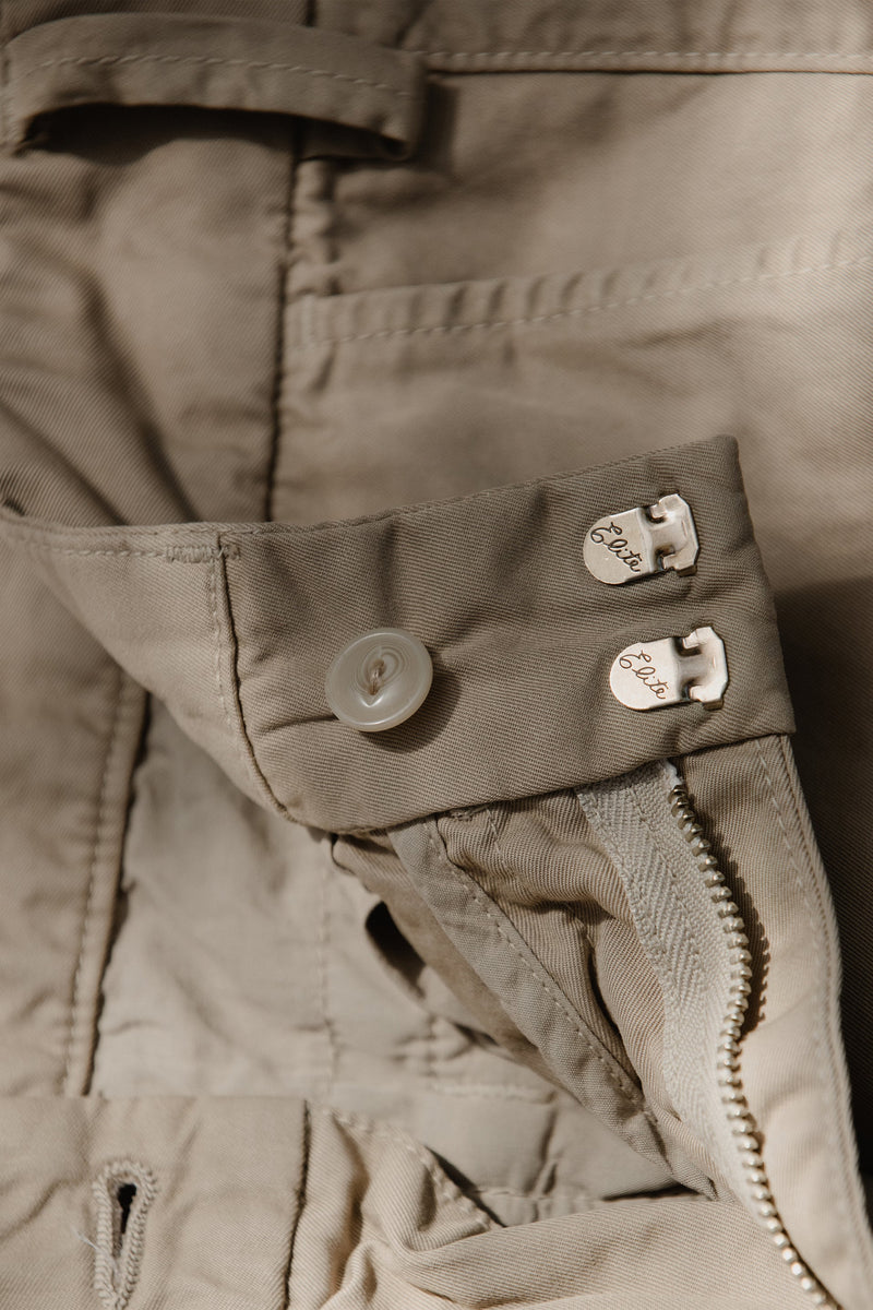 Detail of the Save Khaki United Original Chino hook and bar closure. Made in USA.