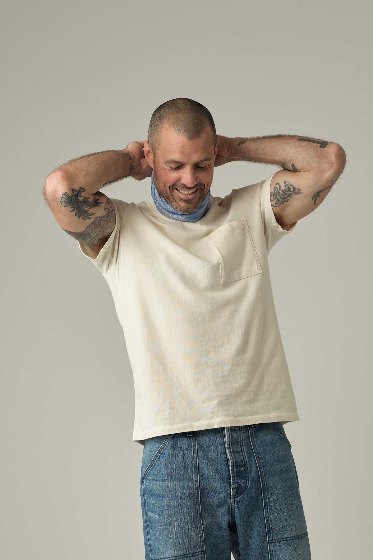 Natural short-sleeve jersey pocket tee with crew neck and chest pocket worn by model