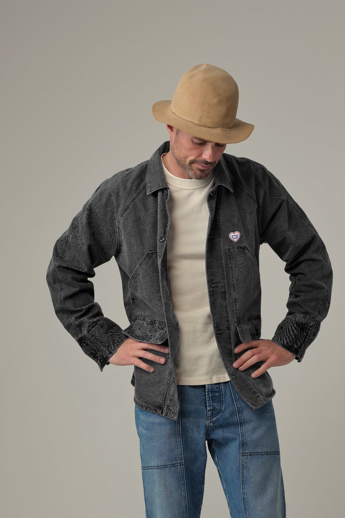 Charcoal chore jacket on model, button front, pointed collar, flap chest pocket