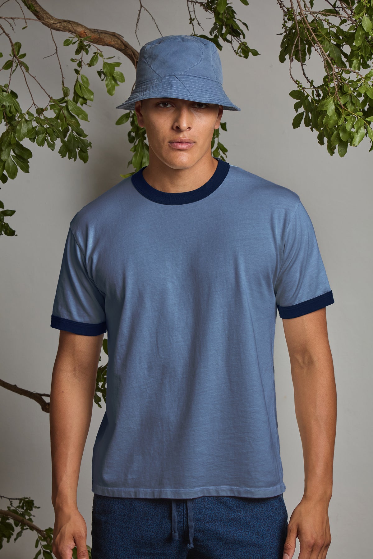 Union blue ringer t-shirt with dark navy crew neck trim on model, short sleeves