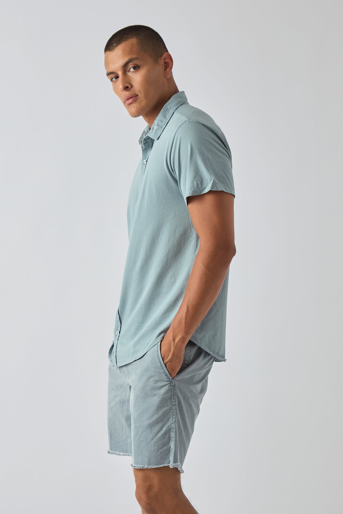 Men's short-sleeve easy jersey shirt, light blue, button-front with spread collar.