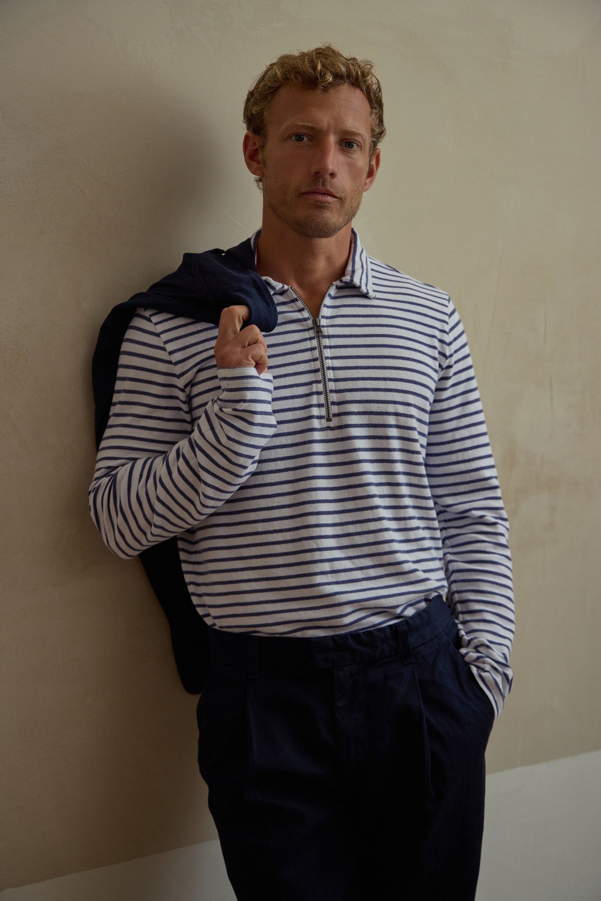 Men's striped quarter-zip pullover with navy-and-white stripes and front half-zip