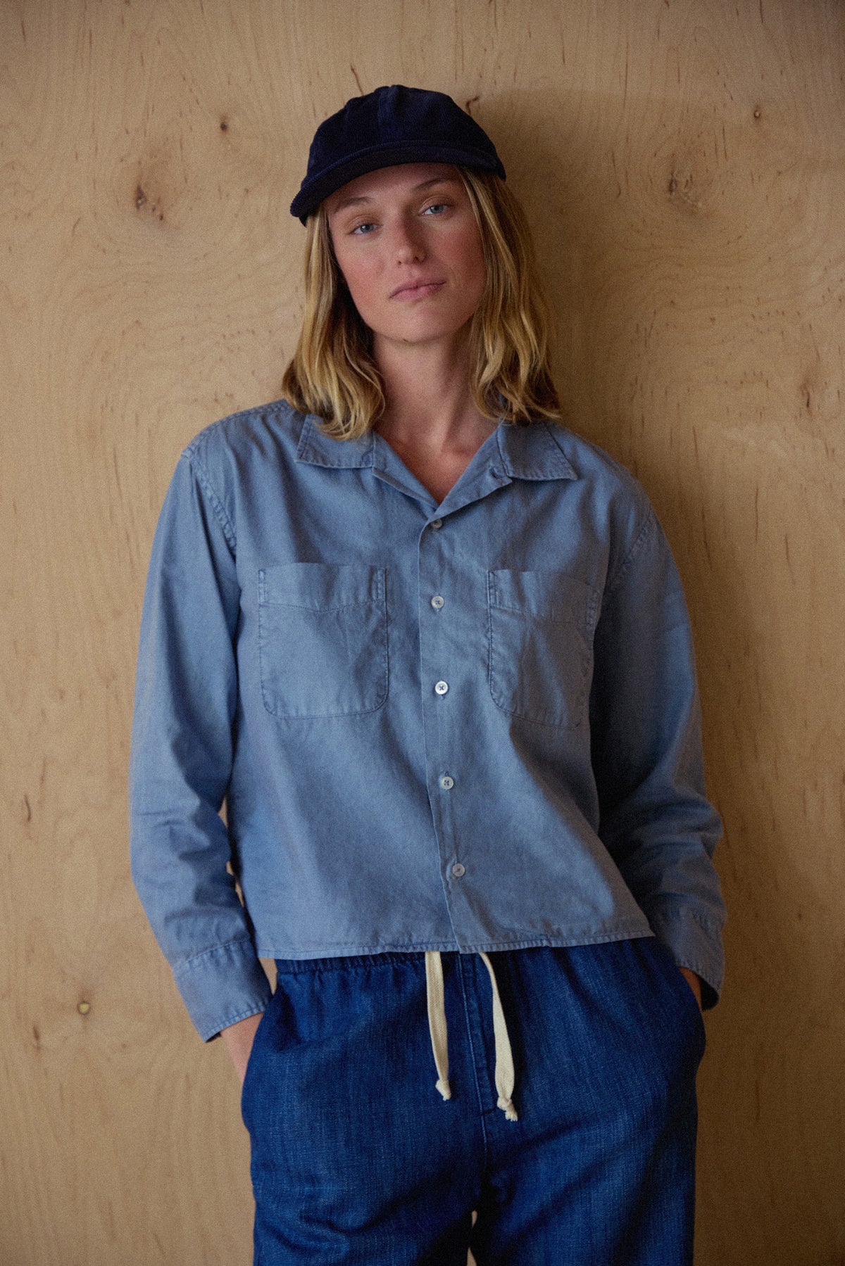 Blue boxy Oxford shirt with button front and pointed collar, chest patch pockets