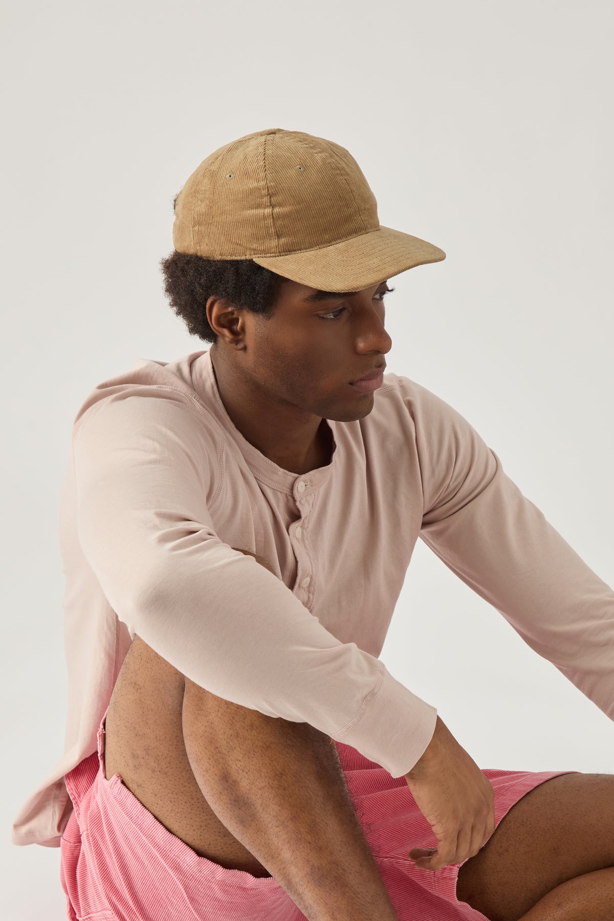 Beige corduroy baseball cap with curved brim and adjustable back strap