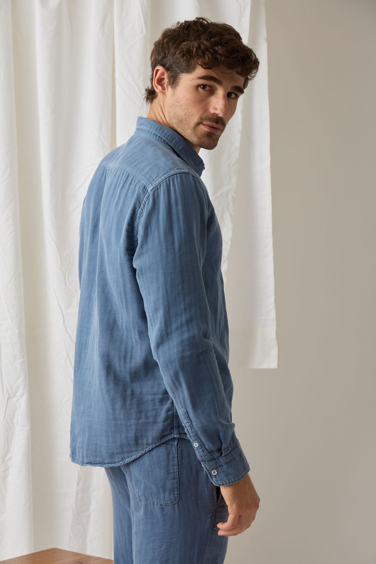 Men's light blue button-up easy shirt, long sleeves, collared neckline, button front