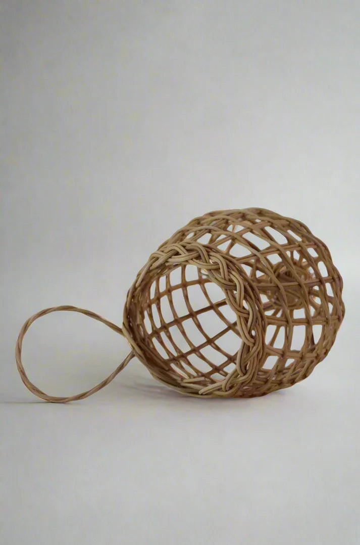 Sweet onion basket with open weave net and long loop handle, light tan color.