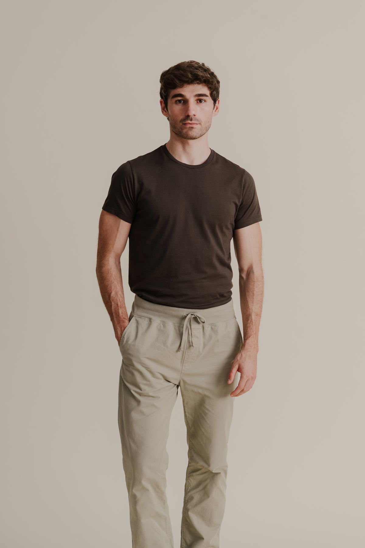 Light khaki twill pants with drawstring waist and relaxed tapered legs