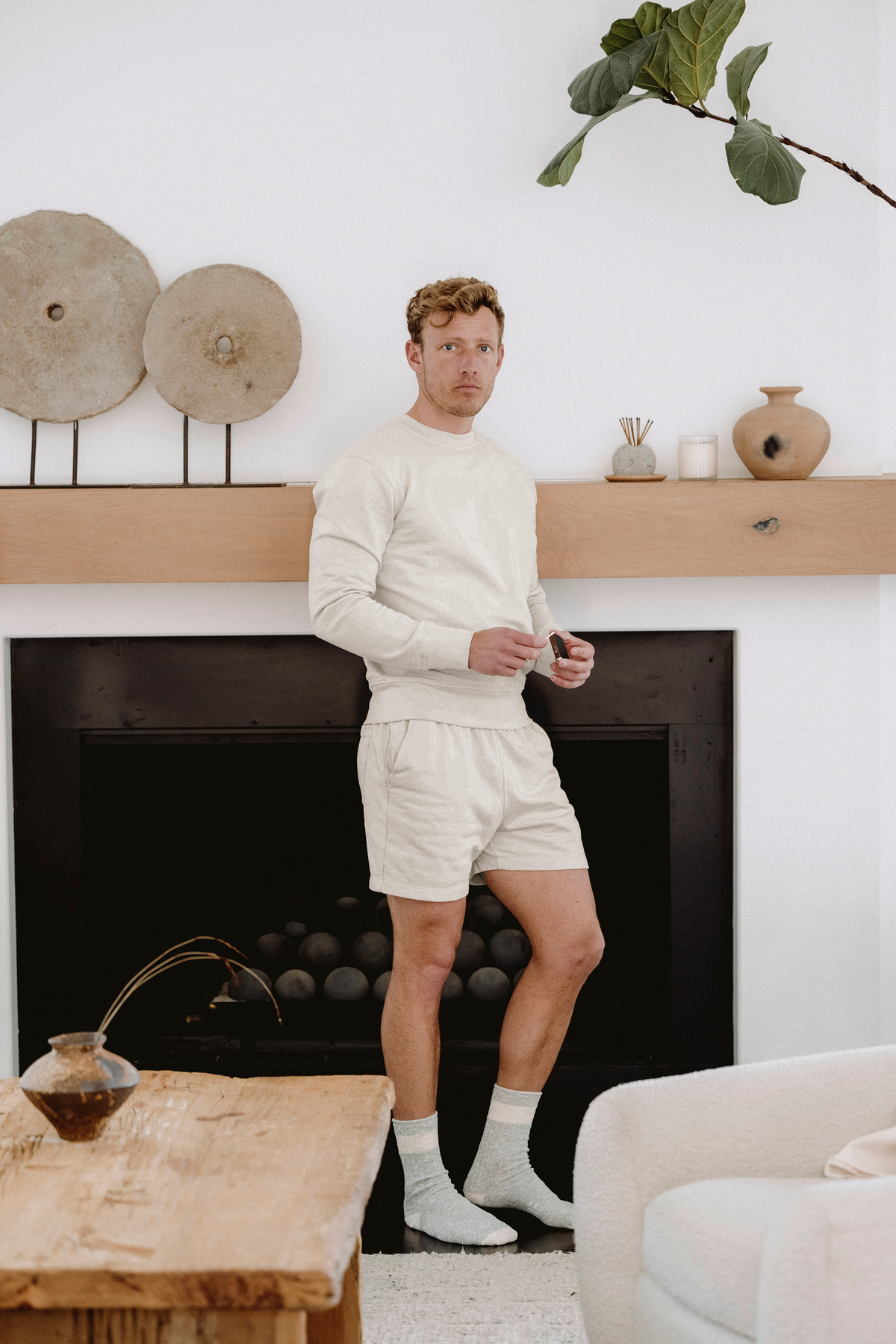 Cream supima fleece shorts with elastic waistband and side pockets