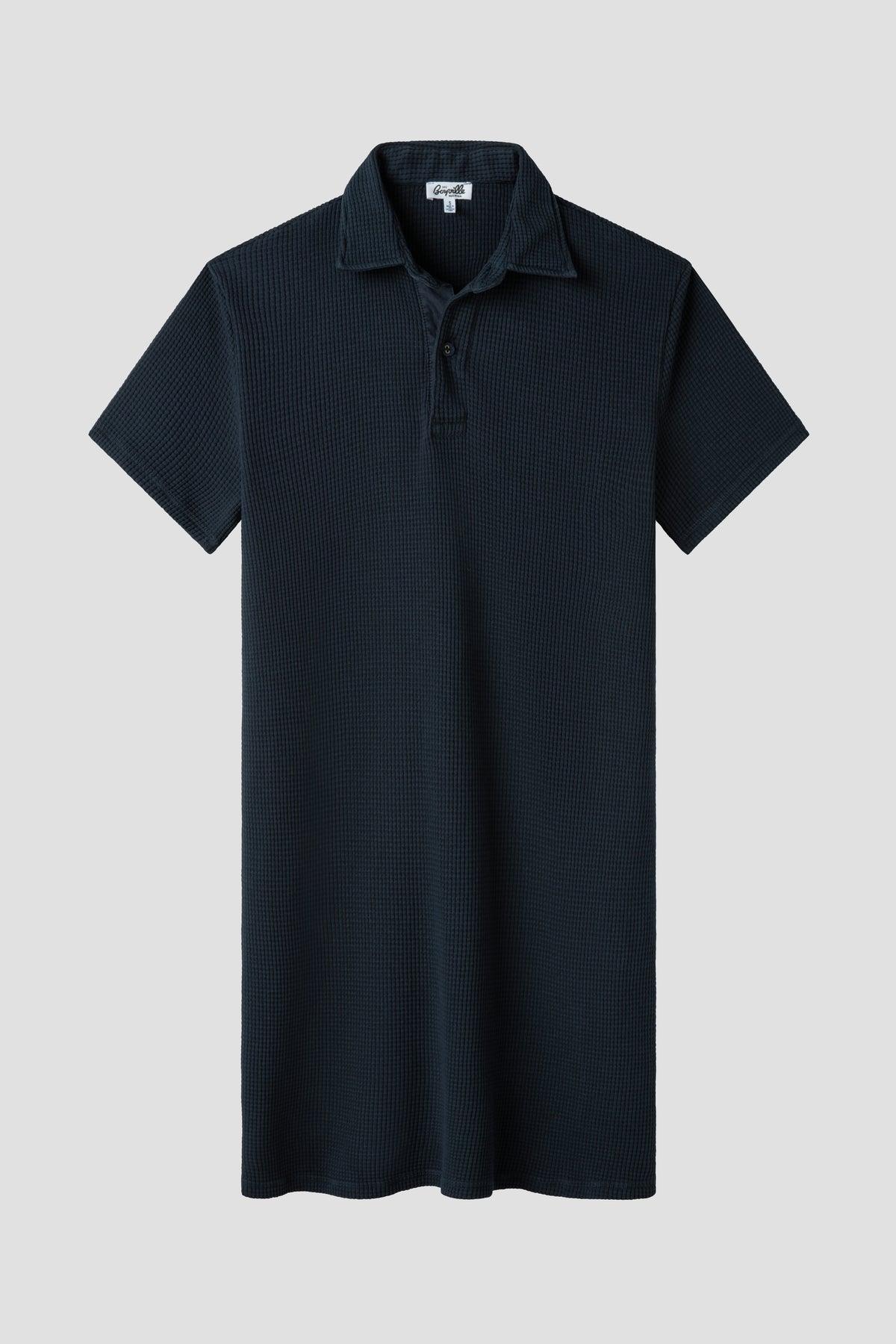 Navy waffle polo dress with short sleeves, pointed collar, button placket, straight hem