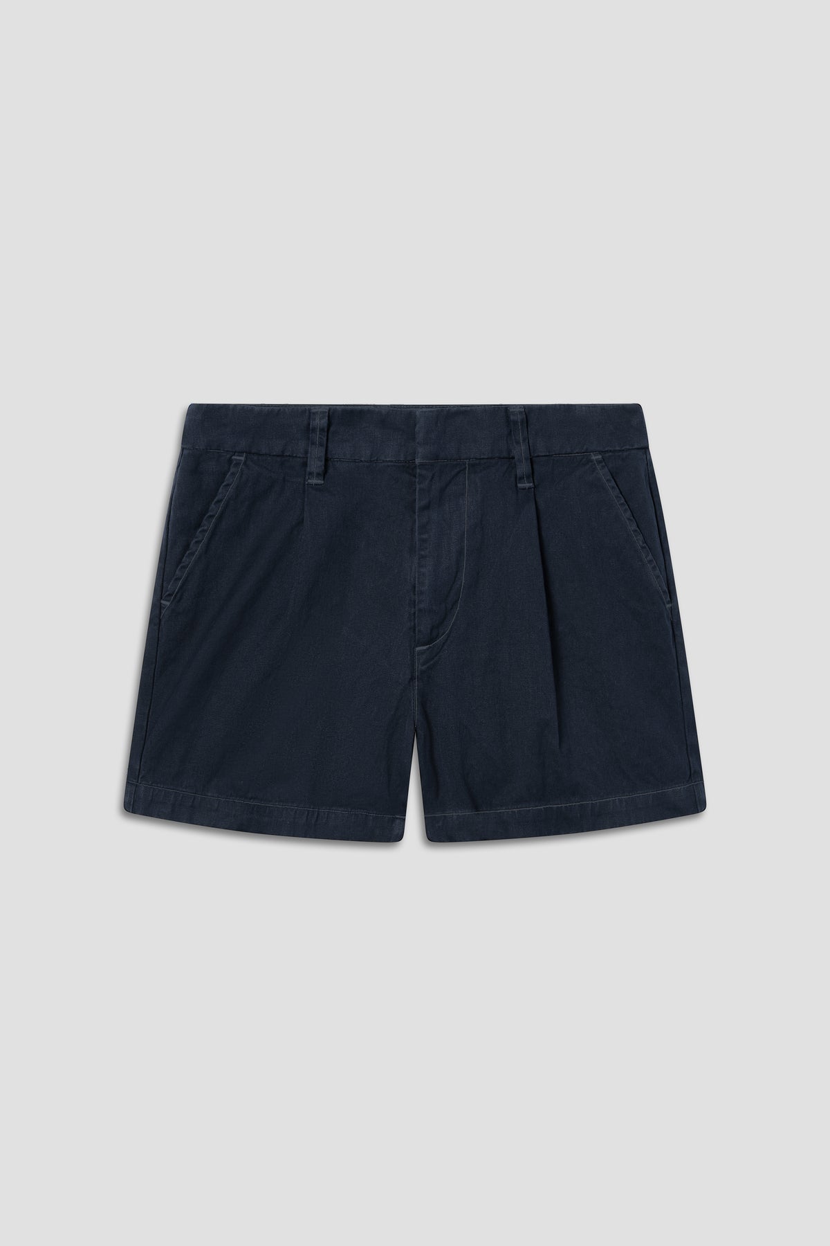 Navy pleated twill shorts with belt loops, front fly, and side pockets