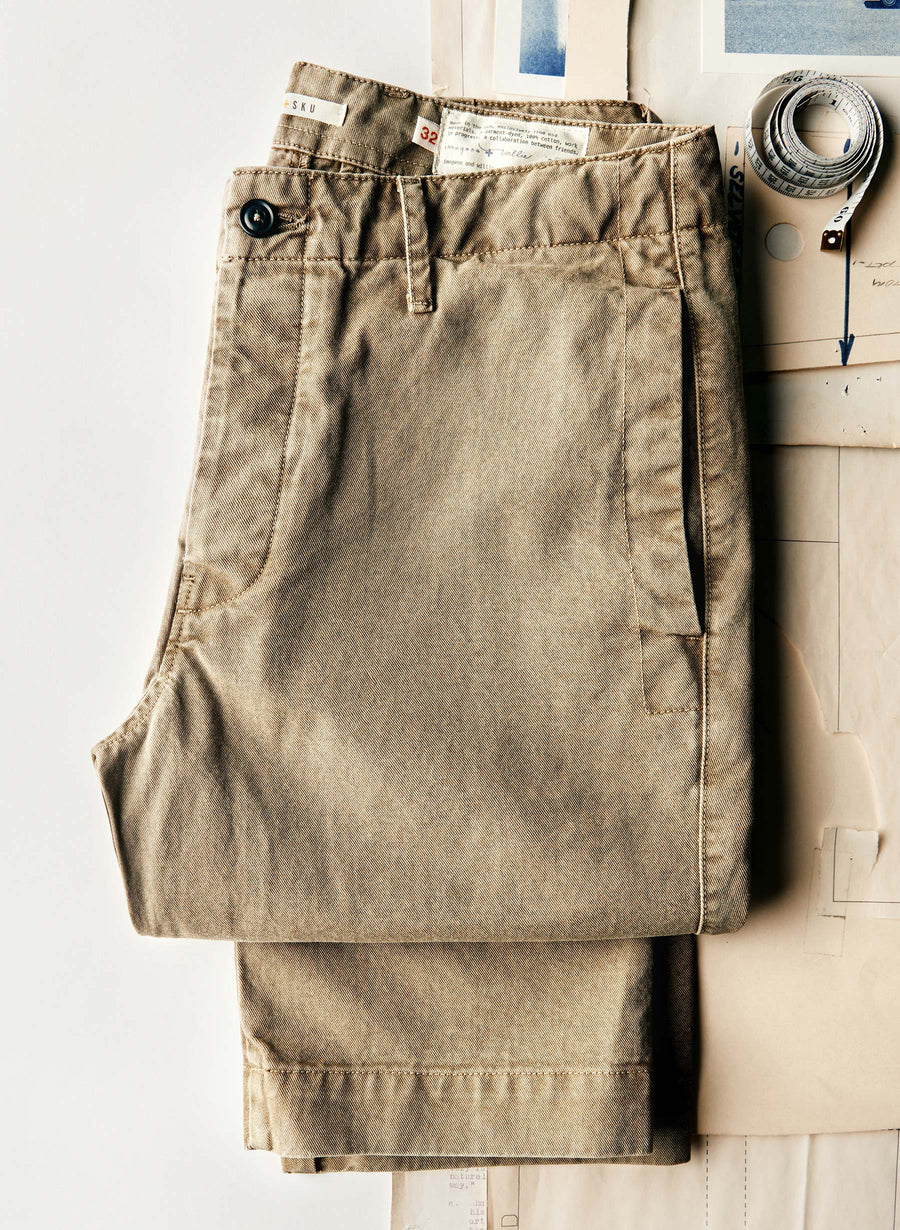 Taupe chino pants with belt loops, button fly, and front pockets