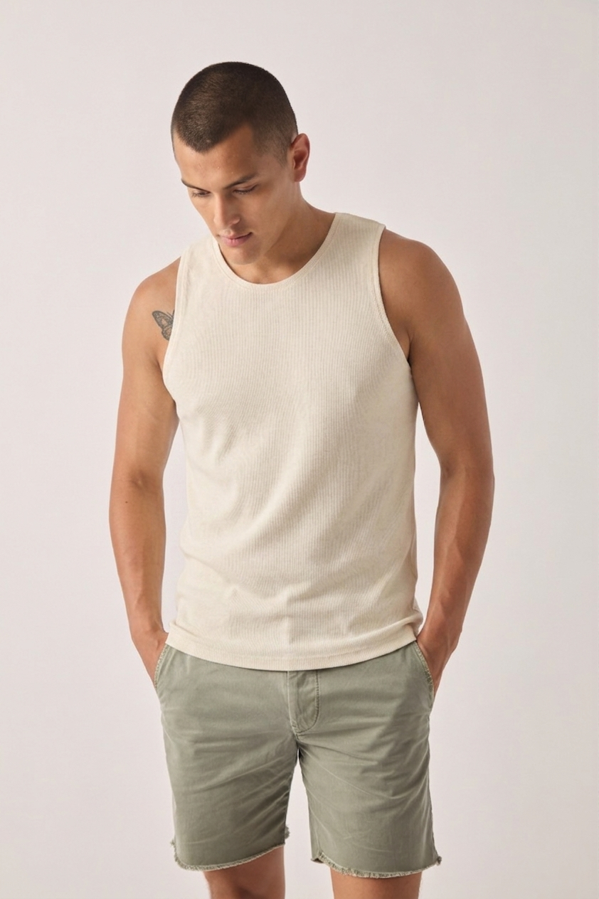 Natural jersey tank top on model, sleeveless crew neck
