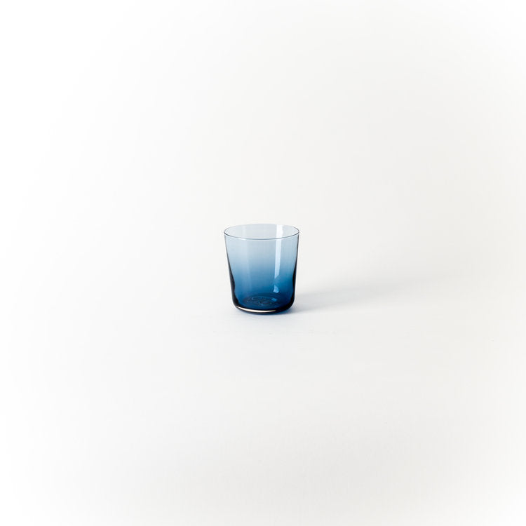 Blue short drinking cup with clear rim and rounded sides