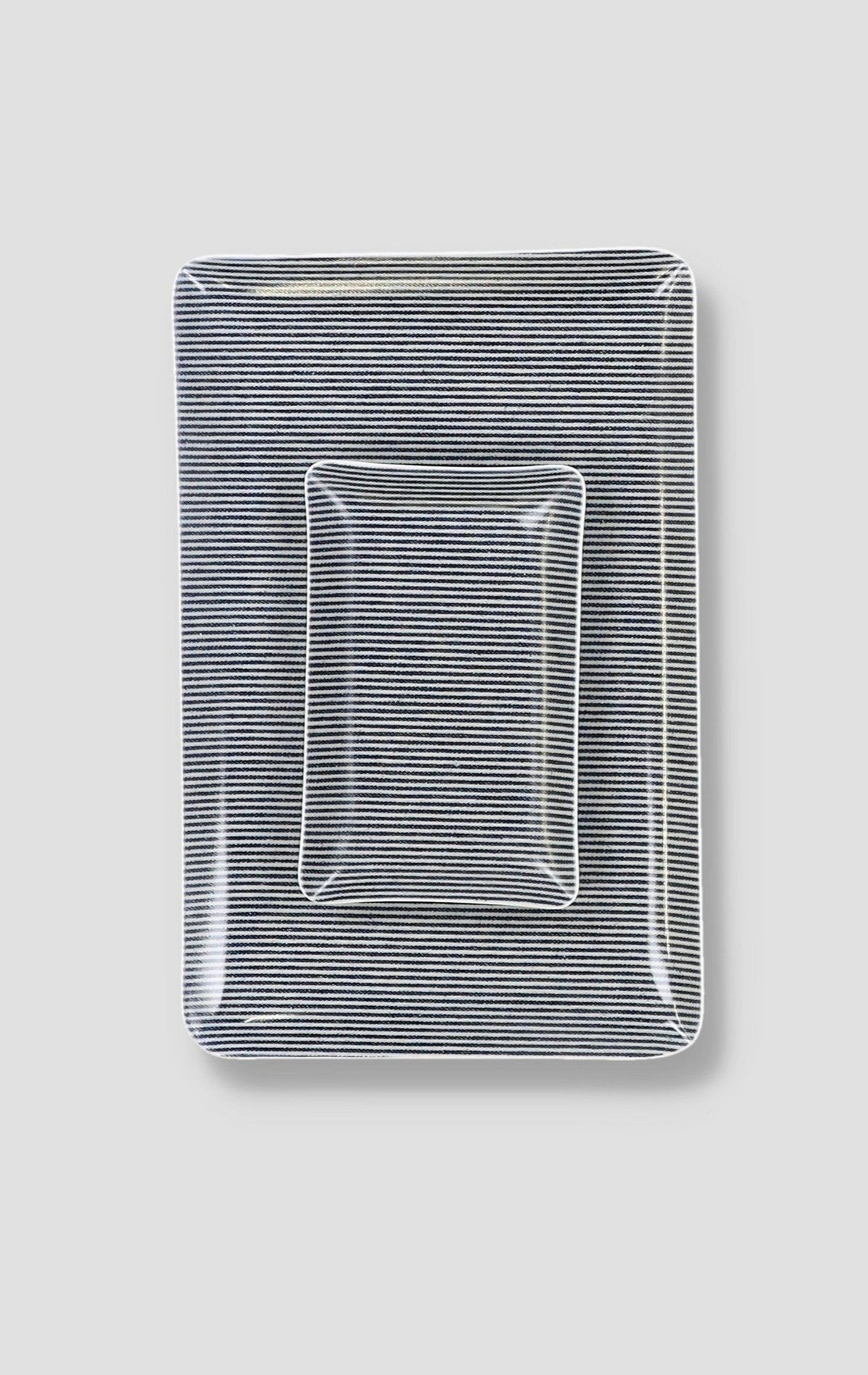 Rectangular laminated tray with navy-and-white horizontal stripes and raised rim