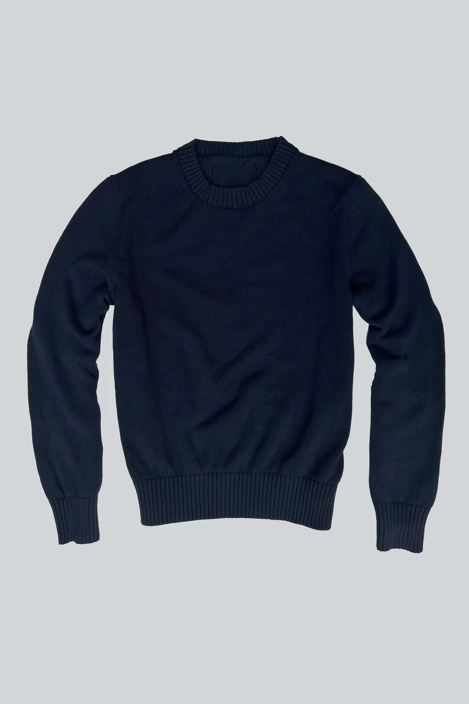 Navy crewneck knit sweater with ribbed collar, cuffs, and hem.